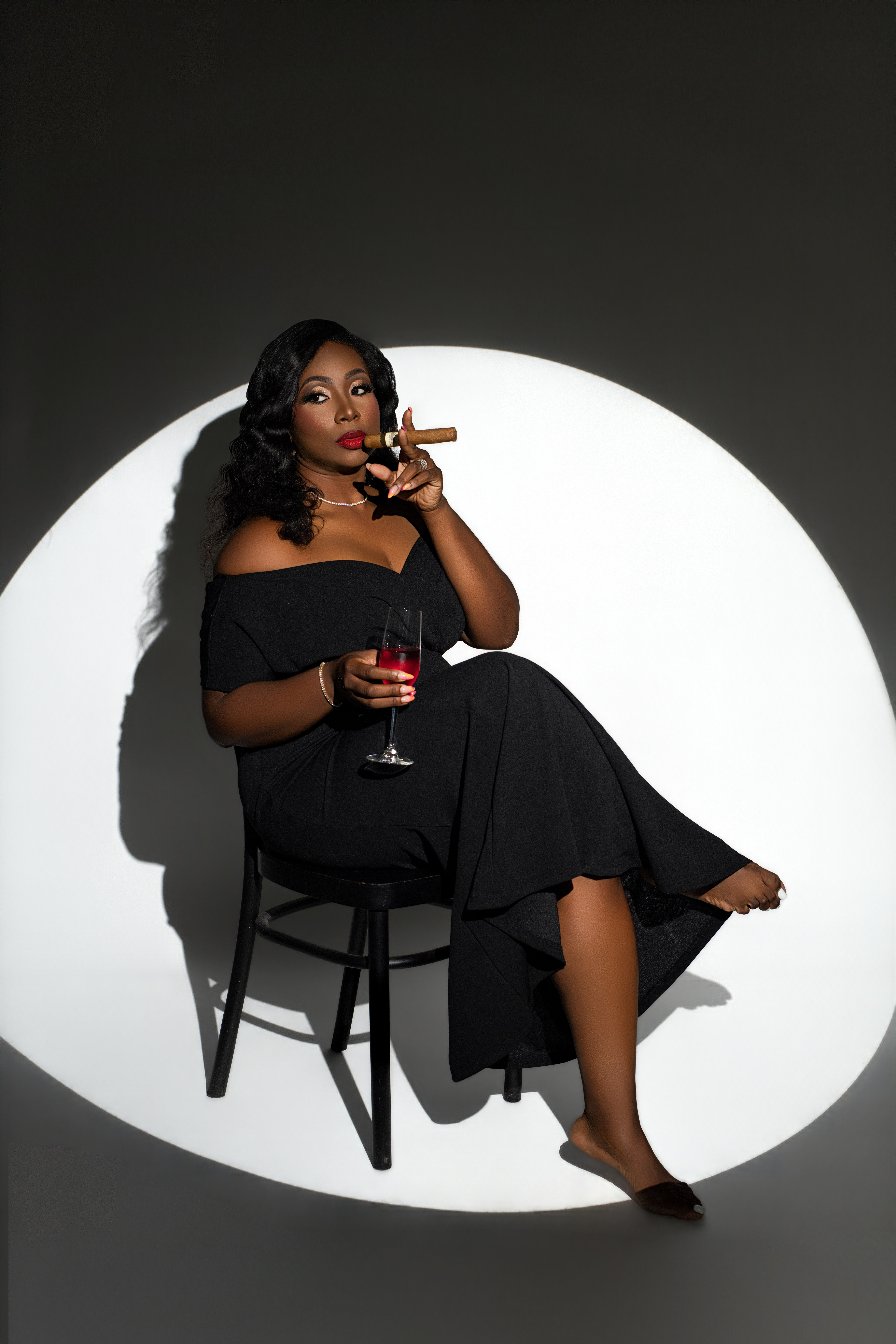 Woman posing in a spotlight setup during a creative self portrait session at SELF. Studios NYC